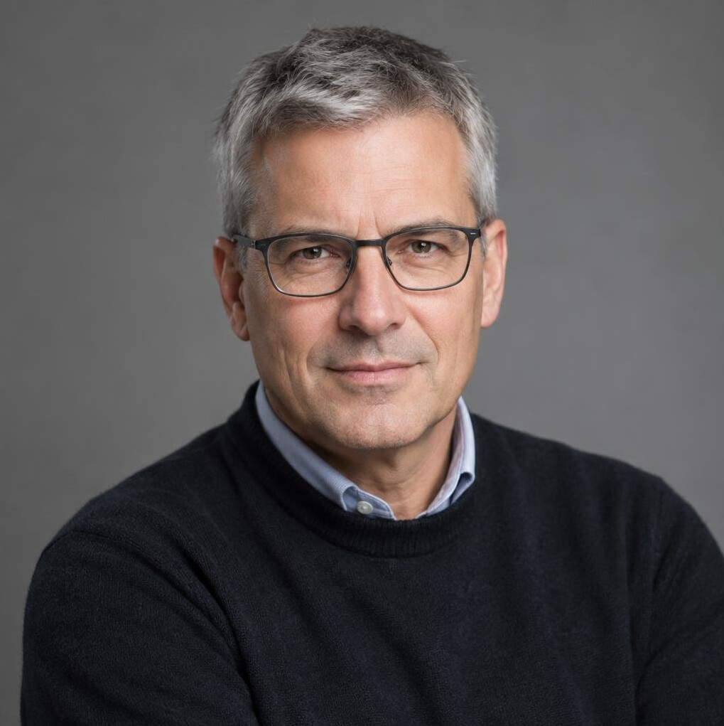 Studio portrait of a Swiss male investigative journalist in his 50s