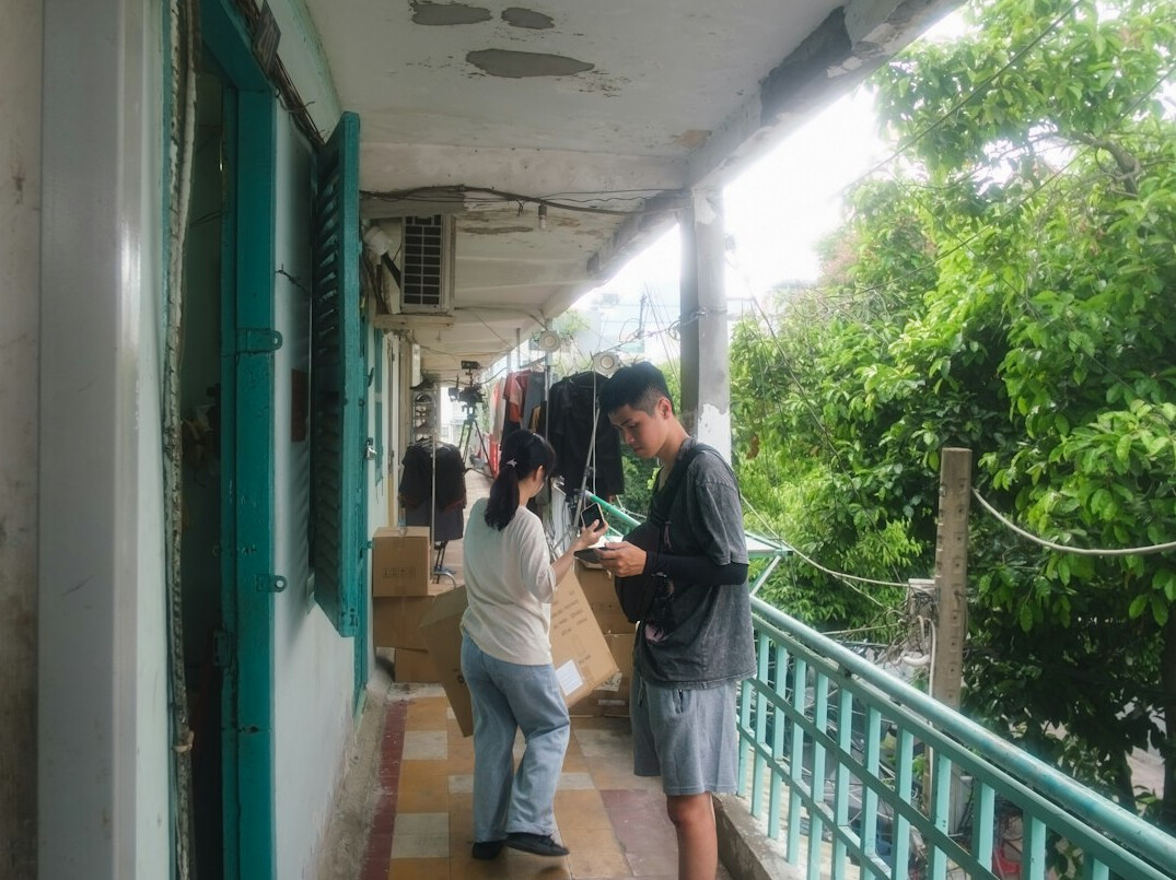 Two journalists cross-checking documents and notes together